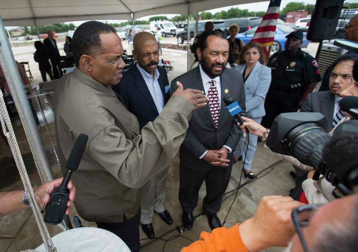 Activist Reginald Moore, from left, State Sen. Borris Miles, D-Houston, and U.S. Rep. Al Green, D-Houston, speak to the media following a news conference celebrating progress on the Sugar Land 95 Memorial Project in Sugar Land in June.