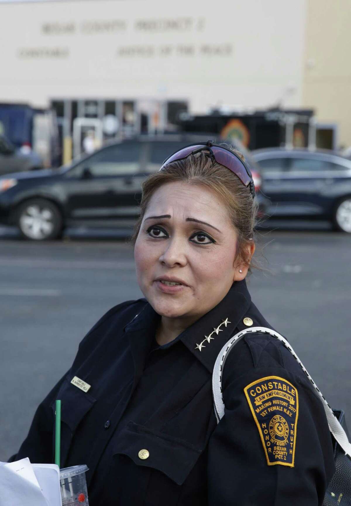 Precinct 2 Constable Michelle Barrientes Vela speaks to members of the media as FBI and Texas Rangers raid her office Monday, Sept. 23.