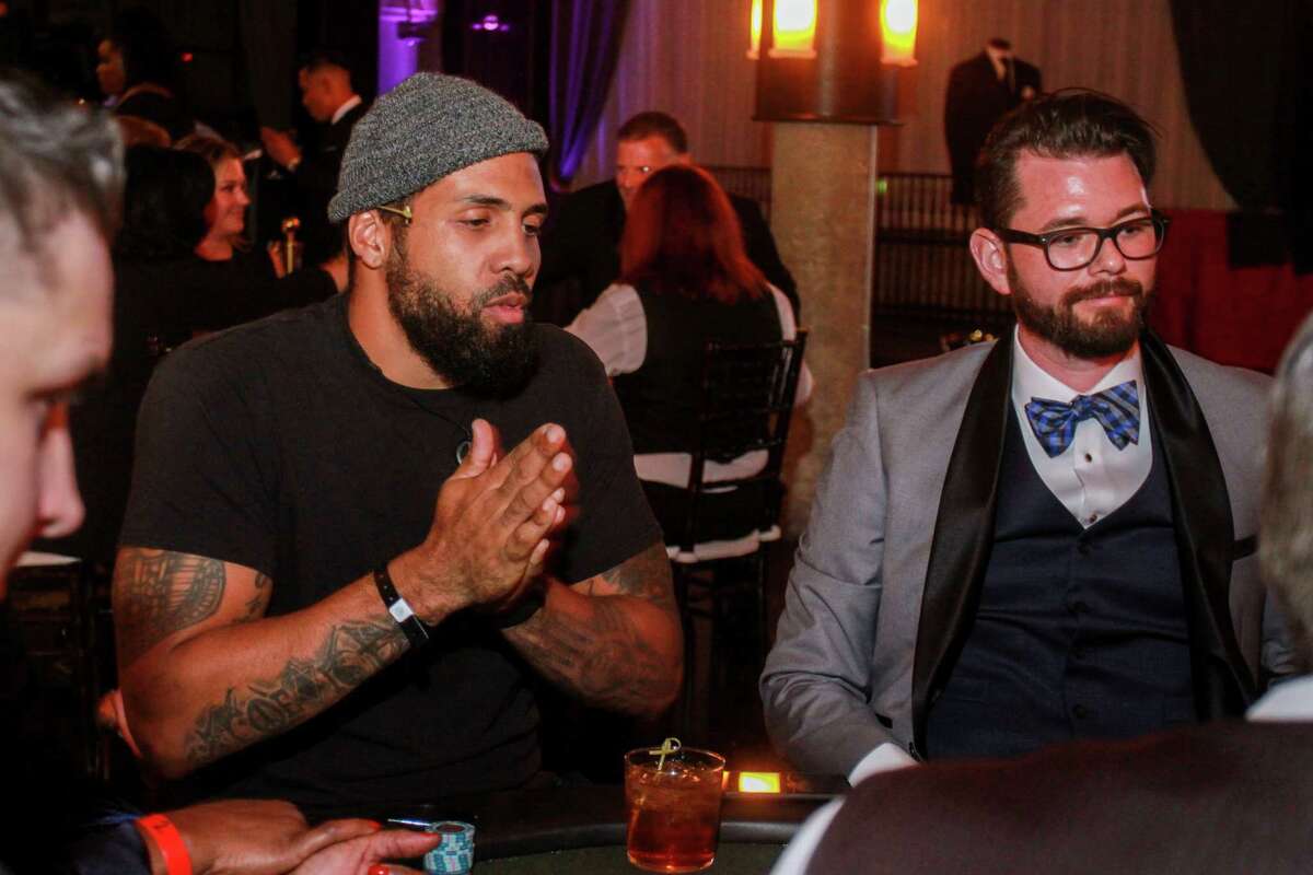 Arian Foster, left, and Erick Warax at Wade Smith's Celebrity Poker Tournament and Casino Night, Bulls and Blackjack, at the Astorian on September 20, 2019.