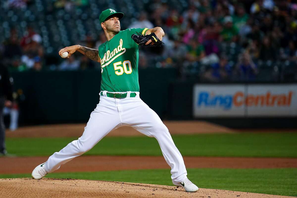 OAKLAND, CALIFORNIA - SEPTEMBER 20: Mike Fiers #50 of the Oakland Athletics pitches during the first inning against the Texas Rangers at Ring Central Coliseum on September 20, 2019 in Oakland, California. (Photo by Daniel Shirey/Getty Images)