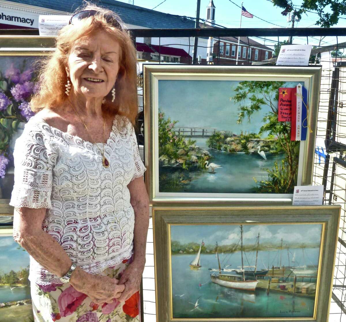 Two ASOG member artists in the 2019 Art Society of Old Greenwich Sidewalk Art Show, which took place on September 14 and 15, received special awards given by the Dowling Group, a financial services company in Greenwich. Lucie Anderes, pictured, won the J.M. Dowling CPA Award for her oil painting, “A Bridge at Tod’s Point,” and Carol Nipomnich Dixon won the Dowling Group Award for her embroidered collage, “Garden.”