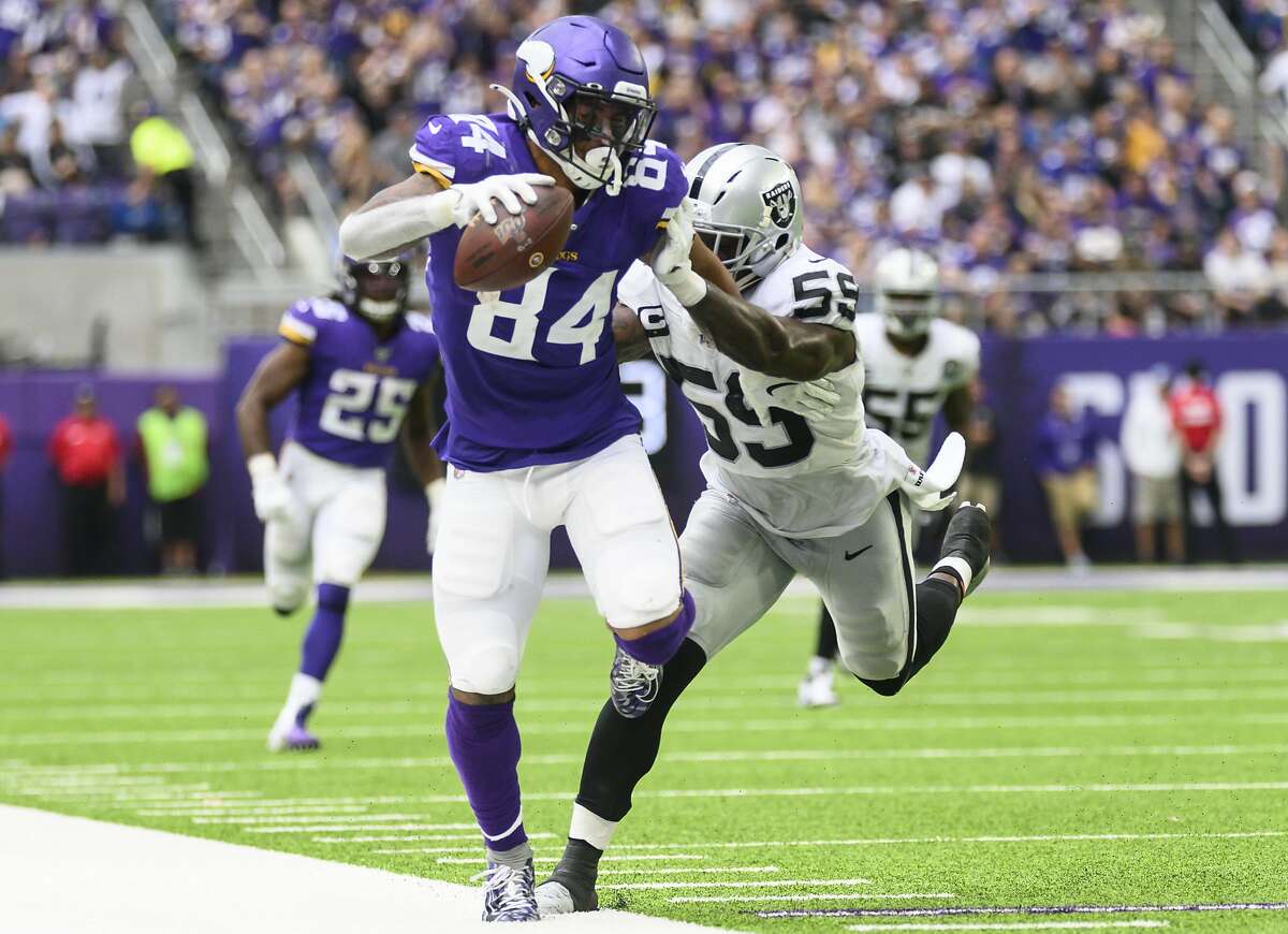 MINNEAPOLIS, MN - SEPTEMBER 22: Irv Smith #84 of the Minnesota Vikings is forced out of bounds with the ball by defender Vontaze Burfict #55 of the Oakland Raiders in the third quarter of the game at U.S. Bank Stadium on September 22, 2019 in Minneapolis, Minnesota. (Photo by Stephen Maturen/Getty Images)