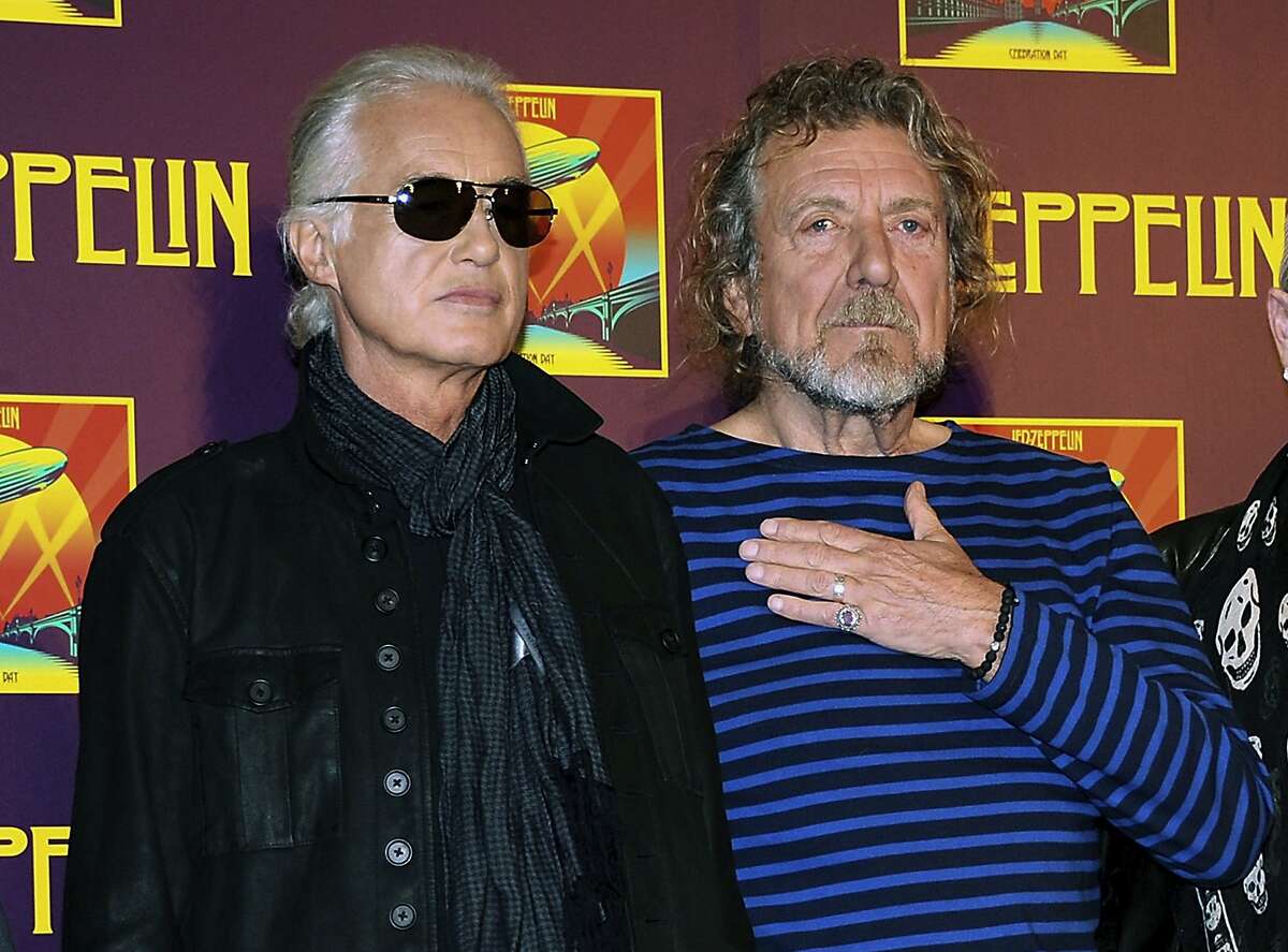 FILE - In this Oct. 9, 2012 file photo, Led Zeppelin guitarist Jimmy Page, left, and singer Robert Plant appear at a news conference ahead of the worldwide theatrical release of "Celebration Day," a concert film of their 2007 London O2 arena reunion show, in New York. A panel of 11 judges from the 9th U.S. Circuit Court of Appeals agreed Monday, June 10, 2019, to hear Led Zeppelin's appeal in a copyright lawsuit alleging the group stole its 1971 rock epic from an obscure 1960s instrumental. (Photo by Evan Agostini/Invision/AP, File)