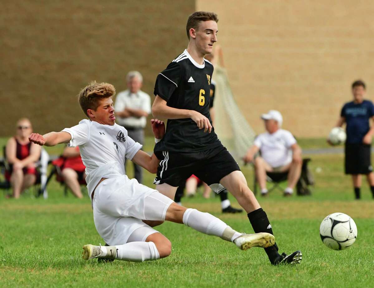 Albany Academy's Brendan Everett, left, and Voorheesville's Jack Whitman battle for the ball during a soccer game on Monday, Sept. 23, 2019 in Voorheesville, N.Y. (Lori Van Buren/Times Union)
