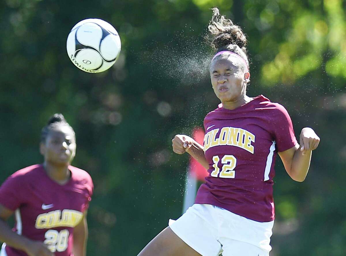 Colonie's Ianah Mackey (12) heads the ball during a Section II girls' soccer game against Guilderland in Colonie, N.Y., Saturday, Sept. 21, 2019. (Hans Pennink / Special to the Times Union)