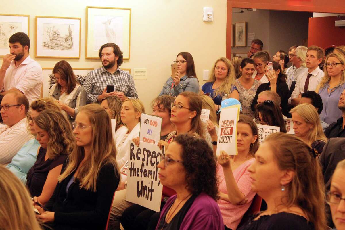 A forum to discuss immunization at the Westport Library drew a large crowd with several audience members carrying signs to signify their stance on the contentious issue. Taken Sept. 23, 2019 in Westport, CT.