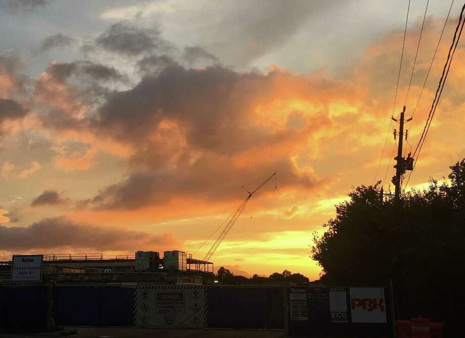 The sunsets in the Houston area have been particularly lively lately. The volcanic ash of Russia has given the sky a purple mist. Photo: Melissa Aguilar, Houston Chronicle / Staff / Houston Chronicle