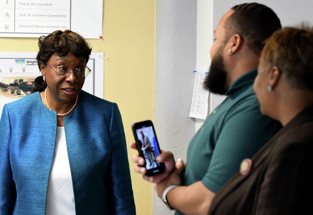 Lucinda Grant Griffin, left, the aunt of Malachi Houze, 5, speaks to Malachi's father, Akiem Houze, center, and grandmother, Donna Sutton, right, after Malachi was honored by Albany County Executive Daniel McCoy with a Citizen of the Month award for his work feeding the homeless on Tuesday, Sept. 24, 2019, at the Brighter Choice Charter School in Albany, N.Y. (Will Waldron/Times Union)