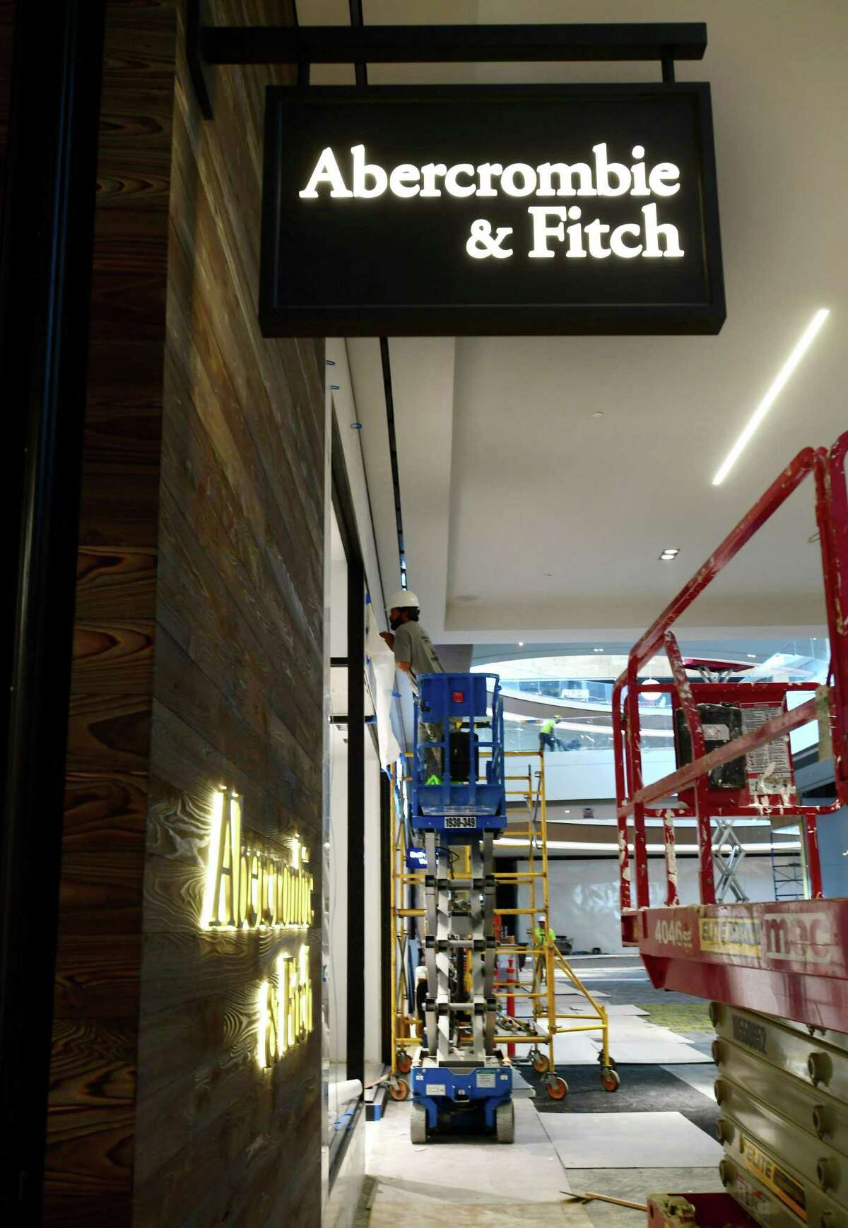 Construction workers fit out a SoNo Collection storefront on Tuesday, Sept. 24, 2019, in advance of the Norwalk, Conn. mall’s opening date on Oct. 11.