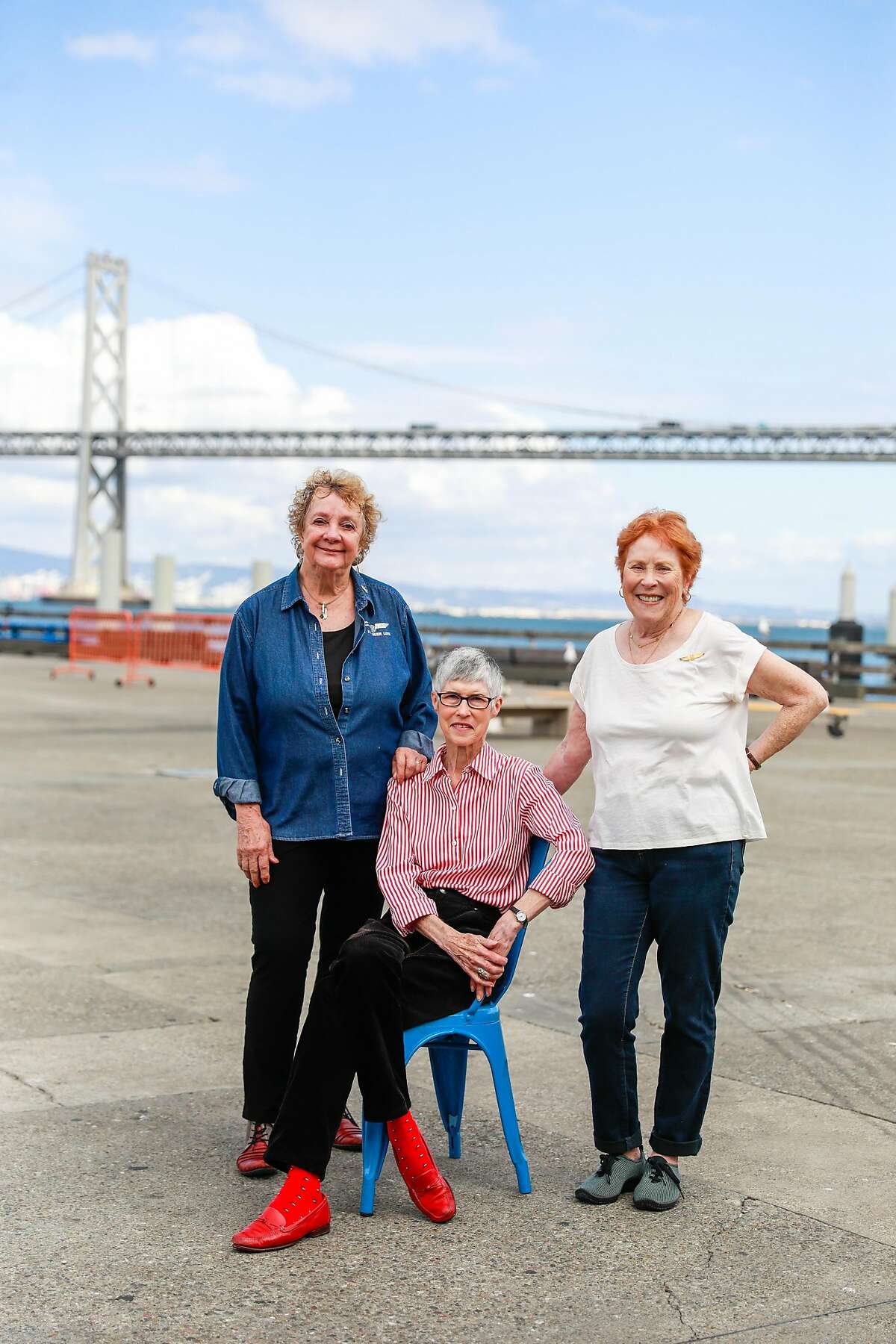 (l-r) Former Flying Tigers flight attendants Marilyn Breen, Sandy Ferguson and Joan Arthur pose for a portrait outside the Ferry Building in San Francisco, California, on Wednesday, Sept. 18, 2019. The former flight attendants were close friends and flew U.S. troops to Vietnam during the Vietnam War.