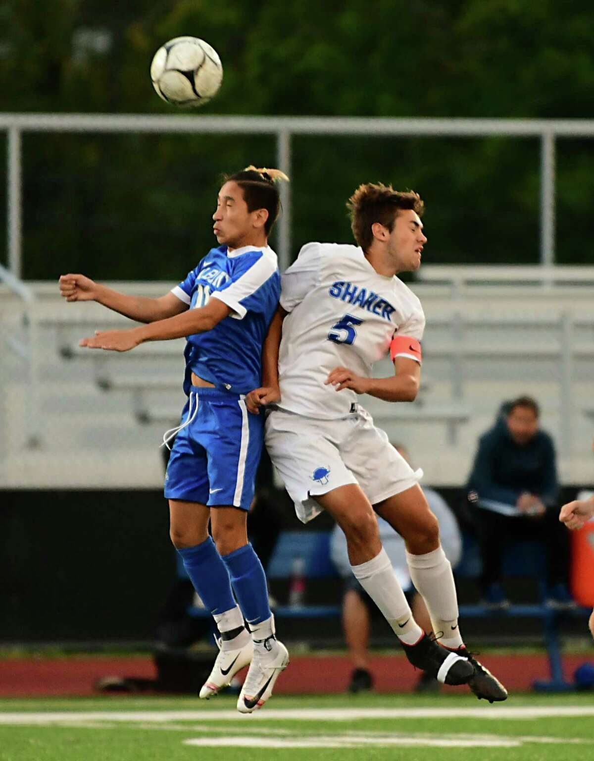 Albany's Sakhi Ghulam Qadir, left, and Shaker's Garrett Drake jump up to head the ball during a soccer game on Tuesday, Sept. 24, 2019 in Albany, N.Y. (Lori Van Buren/Times Union)