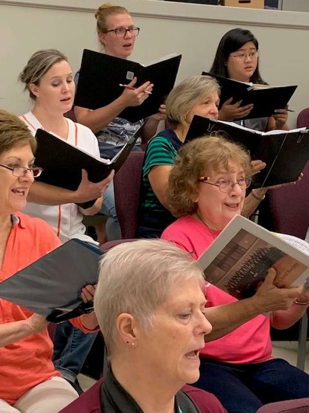 Members of the Montgomery County Choral Society rehearse for the group's first concert set for Thursday, Oct. 3