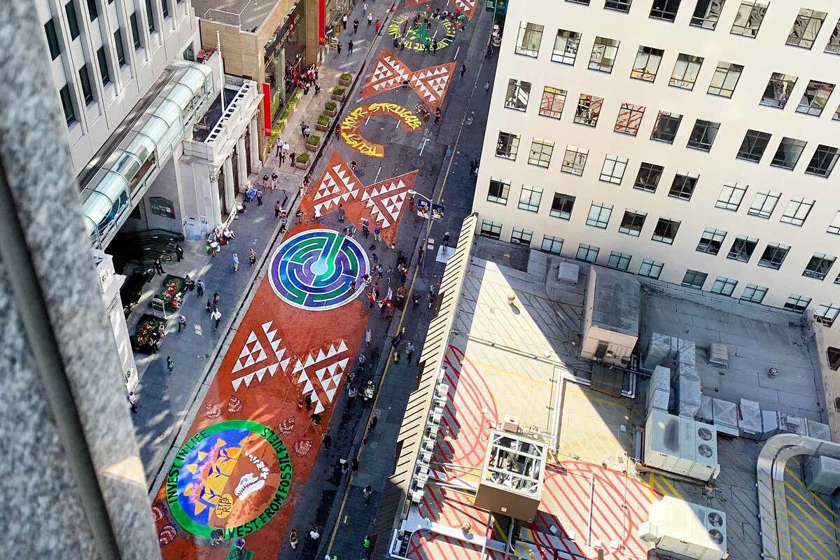 Climate activists with the "Strike for Climate Justice" protest painted a two-block-long stretch of Montgomery Street in San Francisco with a mural on Sept. 25, 2019