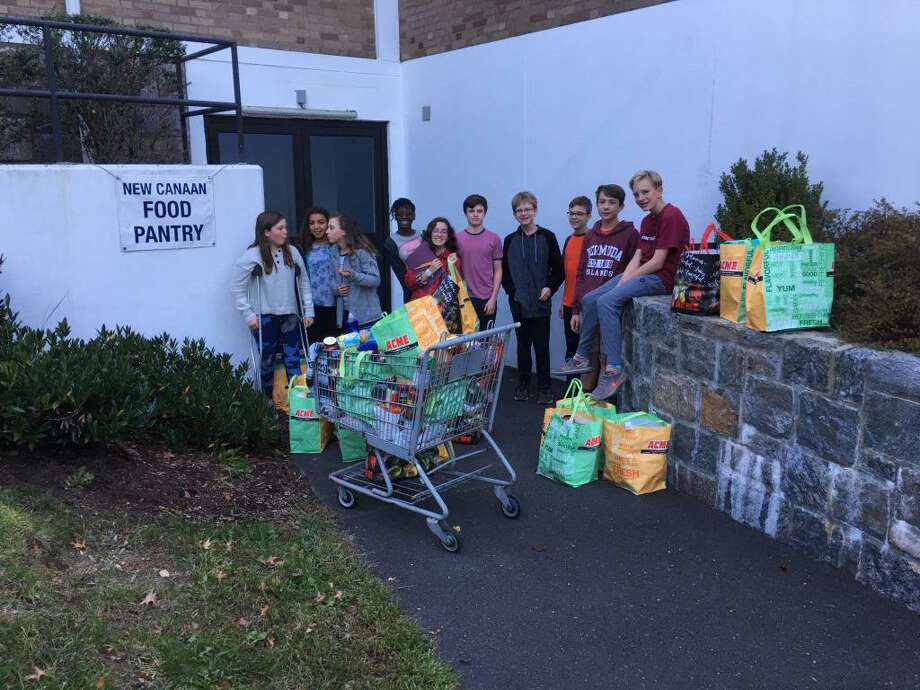 Students in the First Presbyterian Church of New Canaan Confirmation class deliver food to New Canaan Food Pantry where supplies are needed. Photo: First Presbyterian Church Of New Canaan