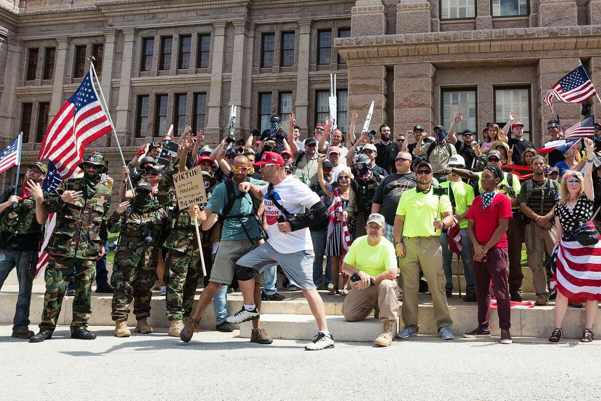FILE - Protesters held a rally at the Texas state Capitol, calling for the impeachment of United States President Donald Trump on July 2, 2017.
