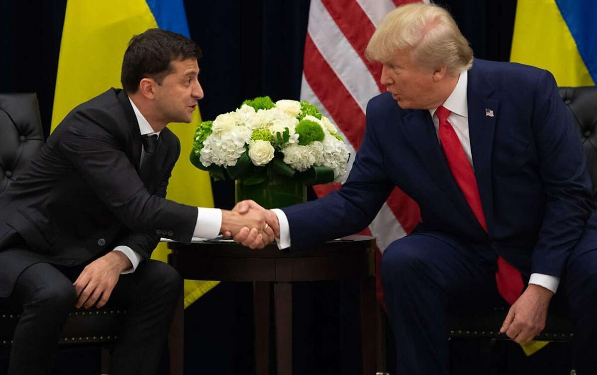 US President Donald Trump and Ukrainian President Volodymyr Zelensky shake hands during a meeting in New York on September 25, 2019, on the sidelines of the United Nations General Assembly. 