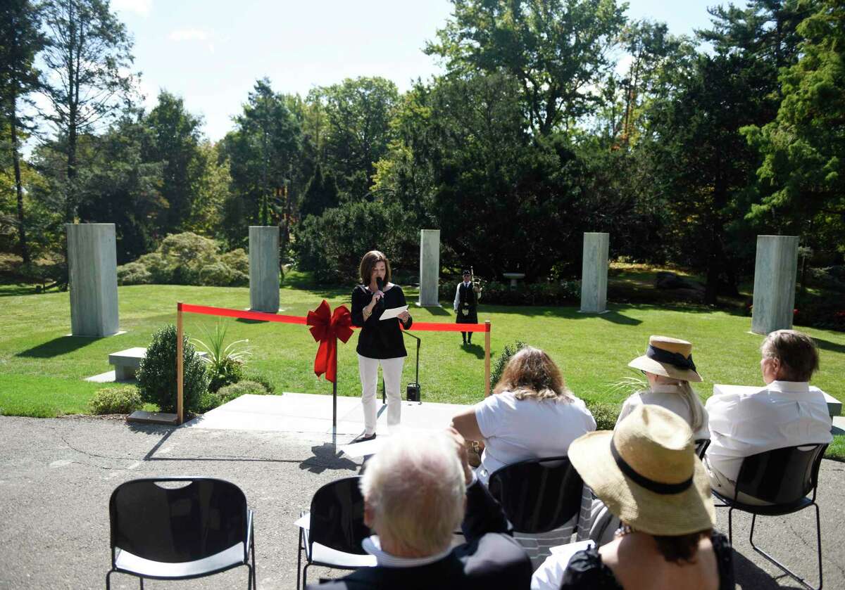 Ambassador-at-Large Bea Crumbine speaks at the Pinetum Monoliths Dedication at the Greenwich Botanical Center in the Cos Cob section of Greenwich, Conn. Wednesday, Sept. 25, 2019. The six 10,000-pound blocks stood stoically, less than a half-mile away, on the grounds of Lia Fail — the estate of the O’Neil family of Greenwich, where they had been part of an amphitheater used to present plays and musical performances.