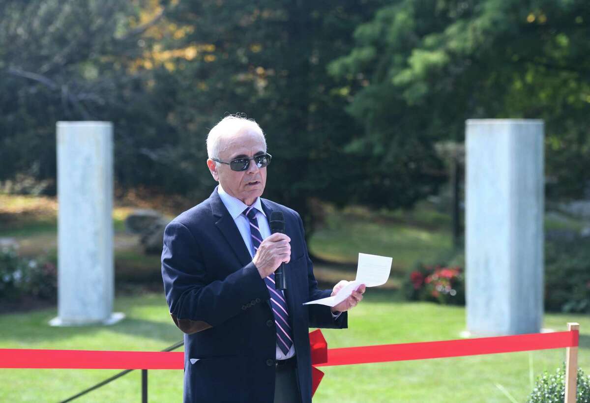 Parks & Recreation board member Frank DiVincenzo speaks at the Pinetum Monoliths Dedication at the Greenwich Botanical Center in the Cos Cob section of Greenwich, Conn. Wednesday, Sept. 25, 2019. The six 10,000-pound blocks stood stoically, less than a half-mile away, on the grounds of Lia Fail — the estate of the O’Neil family of Greenwich, where they had been part of an amphitheater used to present plays and musical performances.