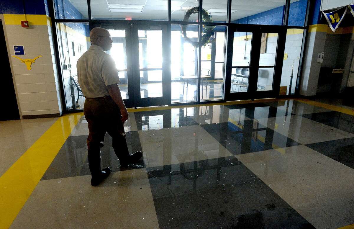 Hamshire-Fannett Superintendent Dwaine Augustine shows the damage to the Intermediate school building, which along with the middle school flooded after Imelda's heavy rainfall. He says the school got about 15" of water inside, some of which remained pooling on the floor in spots Wednesday. Photo taken Wednesday, September 25, 2019 Kim Brent/The Enterprise