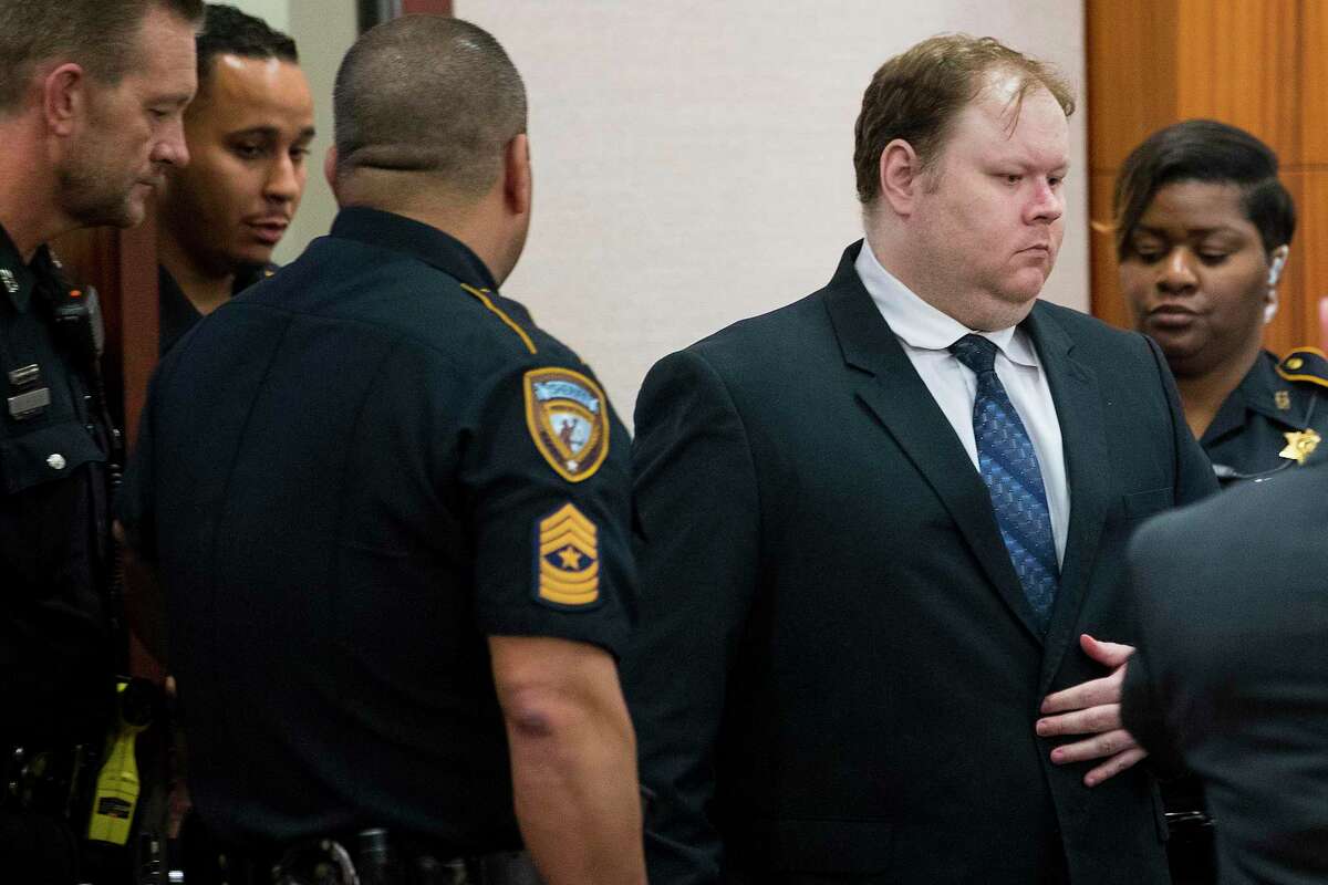 Ronald Haskell is led into Judge George Powell’s courtroom on Wednesday, Sept. 25, 2019, in Houston for closing arguments in his capital murder trial in connection with the 2014 massacre of a Spring family.