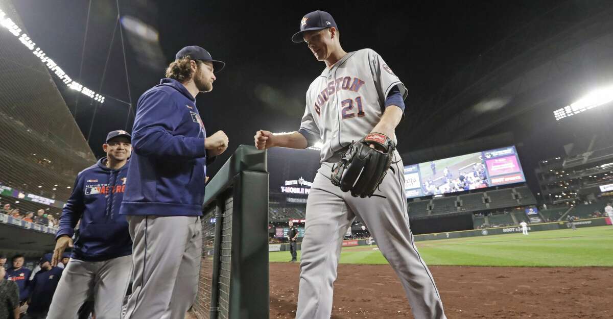 Houston Astros starting pitcher Zack Greinke (21) walks off the field after being removed during the ninth inning of the team's baseball game against the Seattle Mariners on Wednesday, Sept. 25, 2019, in Seattle. The Astros won 3-0. (AP Photo/Elaine Thompson)