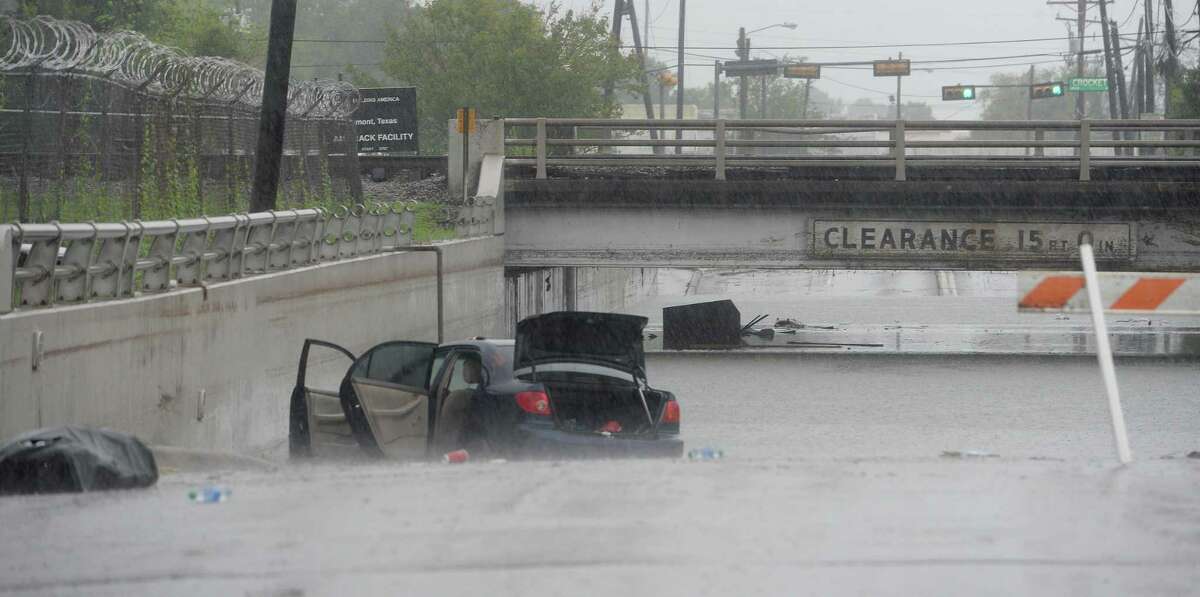 Flooded out cars and debris sit on 4th Street near the train overpass in Beaumont where several roads remained heavily flooded throughout the afternoon. Boaters and other emergency personnel were conducting rescue missions to those in need throughout the morning and afternoon. Photo taken Thursday, September 19, 2019 Kim Brent/The Enterprise