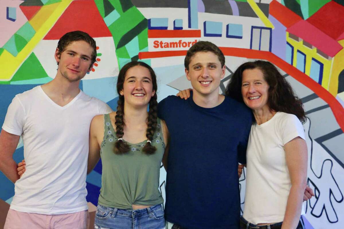 The Russell family of Darien. From left, Aram, Maggie, Liam, Holly. They all volunteer at Building One Community in Stamford.
