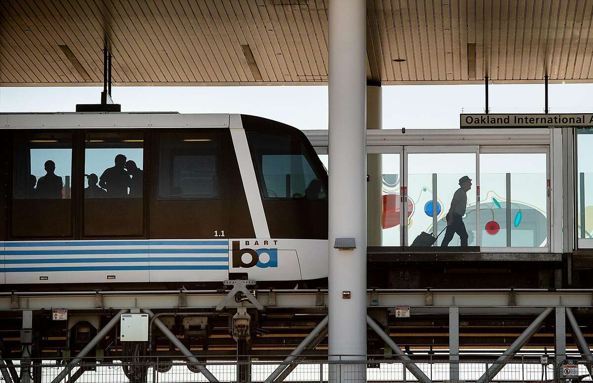 A traveller passes behind security doors after disembarking from an Oakland Airport BART connector train on Tuesday, Sept. 24, 2019, in Oakland, Calif.