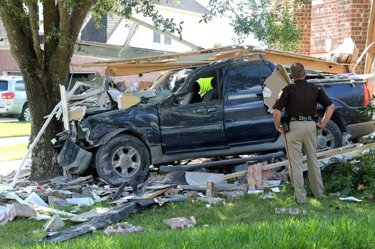 Driver detained after plowing through Katy home