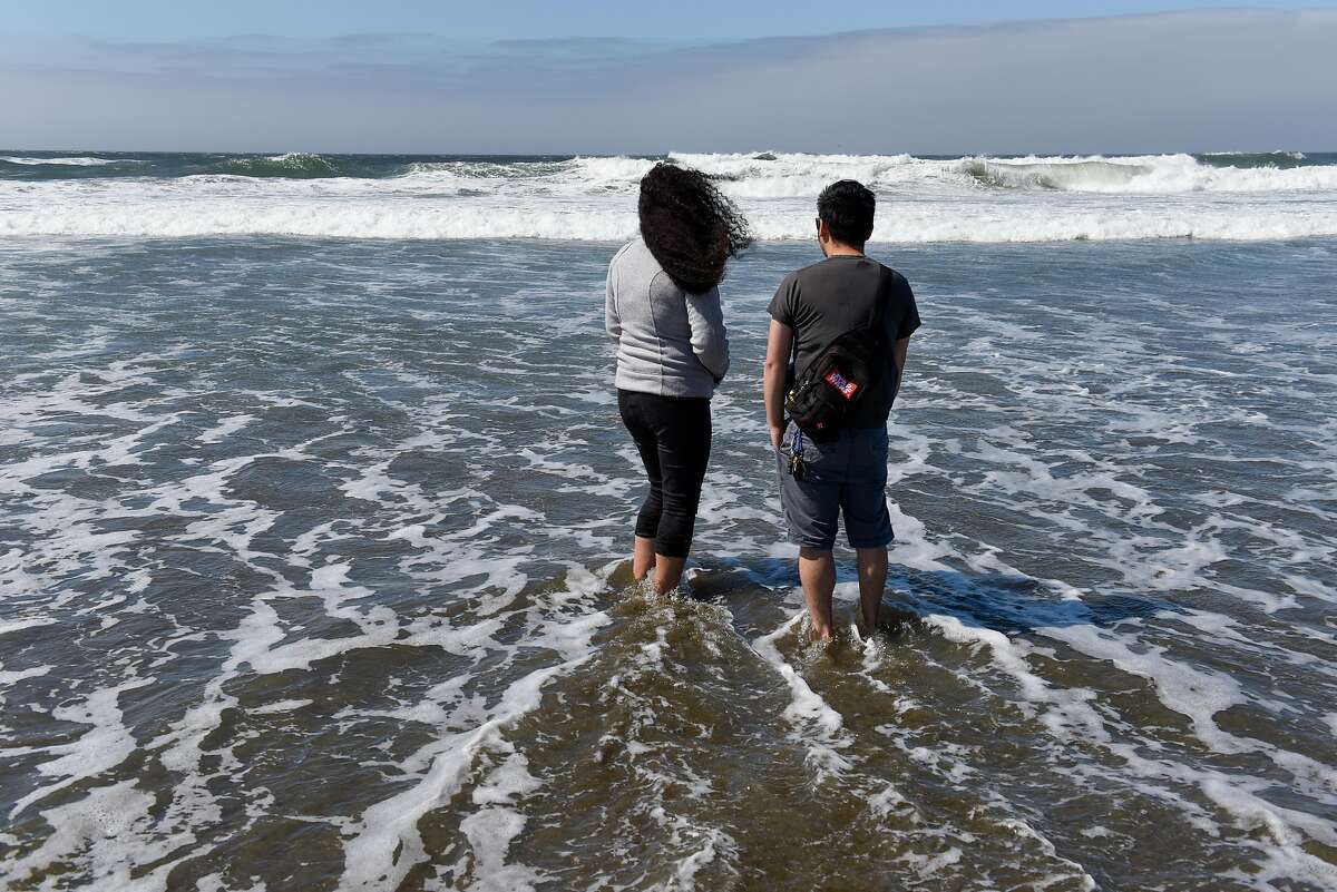 Abigail Cortez and Emilio Wong enjoy the Pacific Ocean at Ocean Beach on September 26, 2019 in San Francisco, Calif.