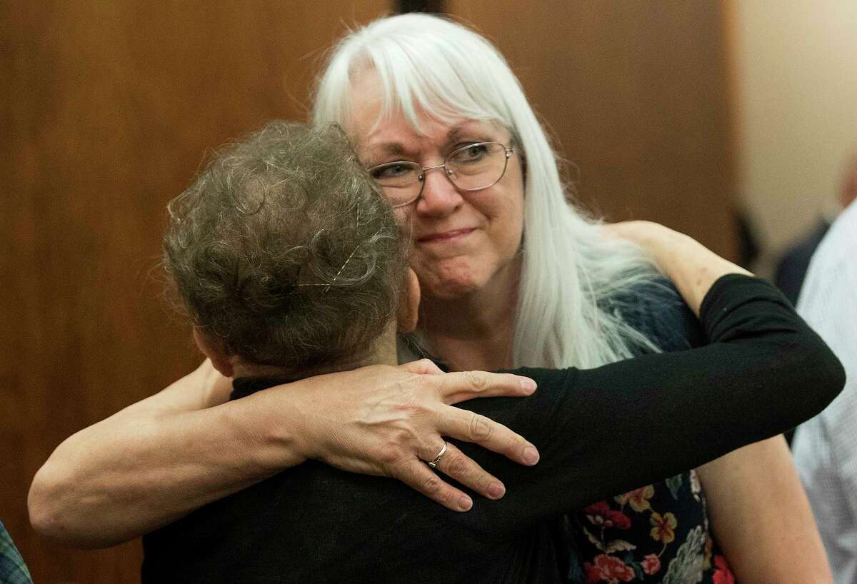 Joyce Stay, left, and Kelly Lyon hug as they react as Ronald Haskell is found guilty of capital murder in the shooting death of her children on Thursday, Sept. 26, 2019, in Houston. Haskell was convicted of capital murder of Katie and Stephen Stay, in connection with the 2014 shooting in which four of the Stay's children were also shot and killed.
