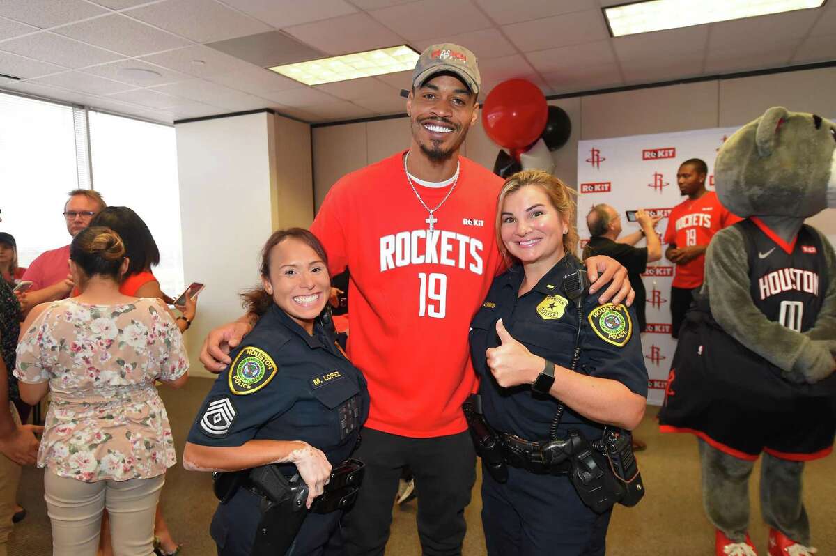 Houston Rockets small forward Gerald Green pose with first responders during the sixth annual 911 Companywide Day Service
