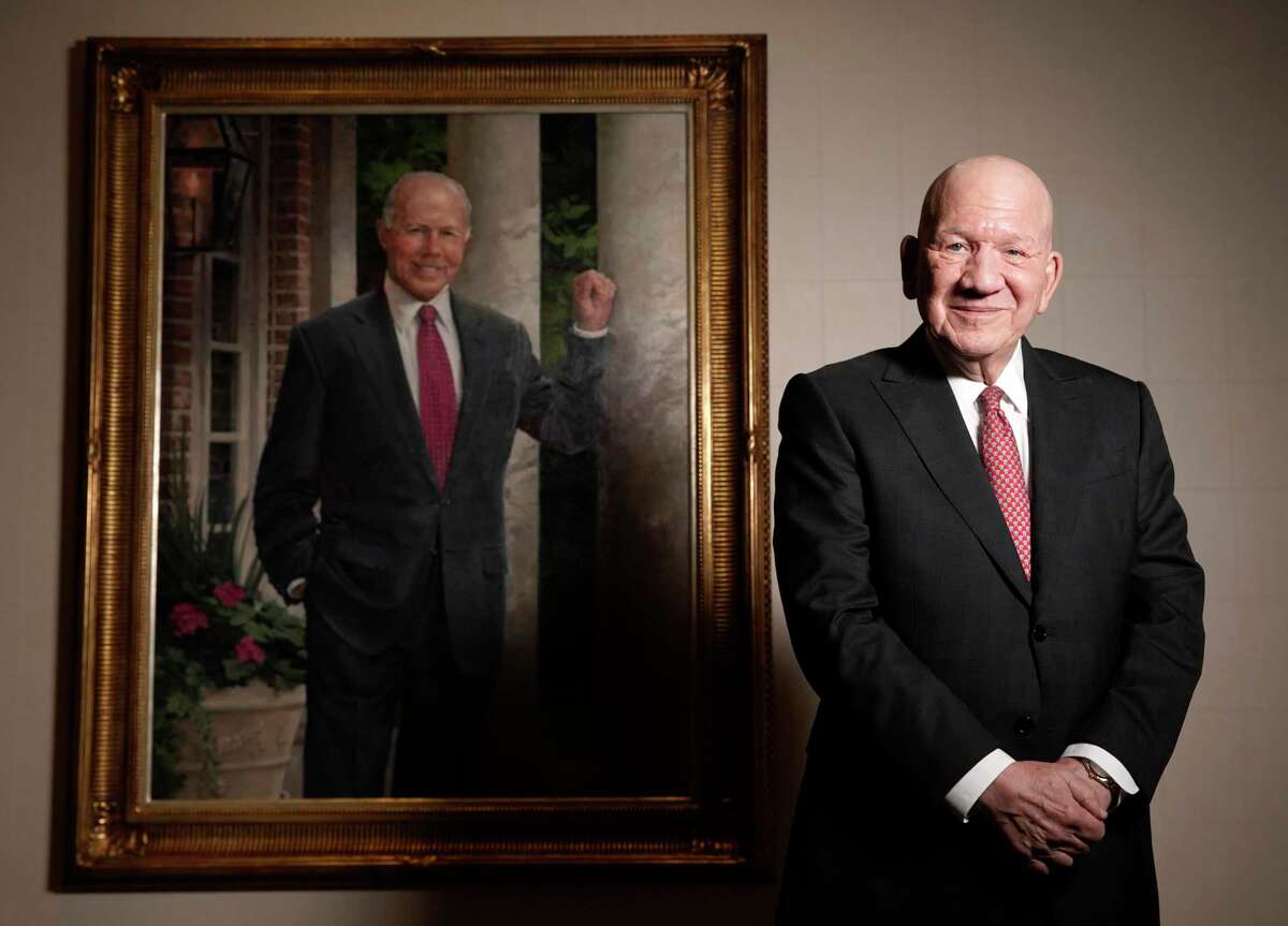Jim Teague, Enterprise Products Partners CEO, stands with a portrait of the late Dan L. Duncan, who was the company founder, shown Tuesday, Sept. 17, 2019, in Houston.