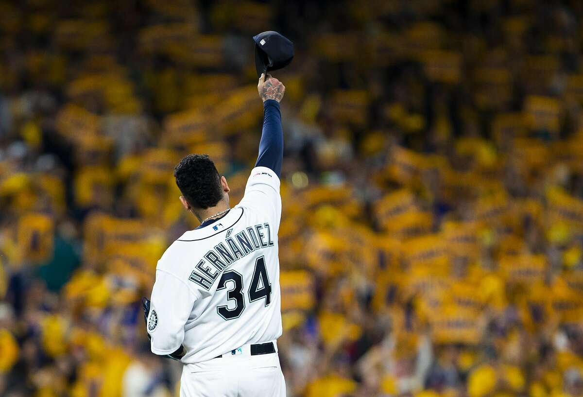 Seattle Mariners' Felix Hernandez walks to the dugout after the