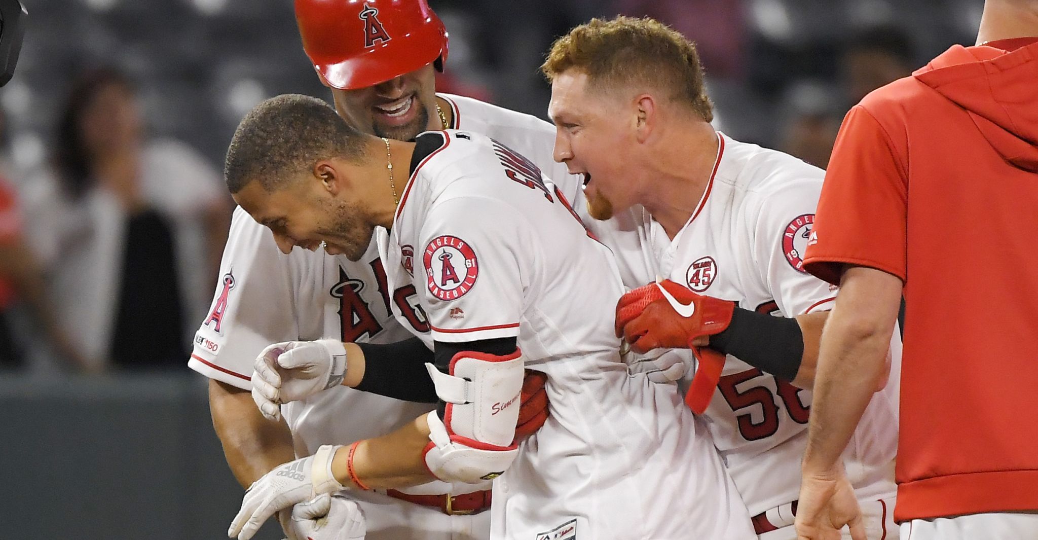 Andrelton Simmons #2 of the Los Angeles Angels is congratulated by