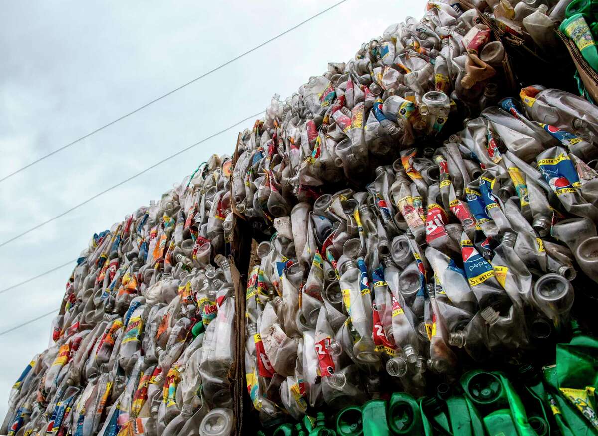 View of pressed plastic bottles stored at a warehouse in southern Santiago, Chile, on Aug. 21, 2019. Recyclers in the U.S. are now awash in dirty plastic, with no outlet for their commodity. Much of that is headed for landfills.