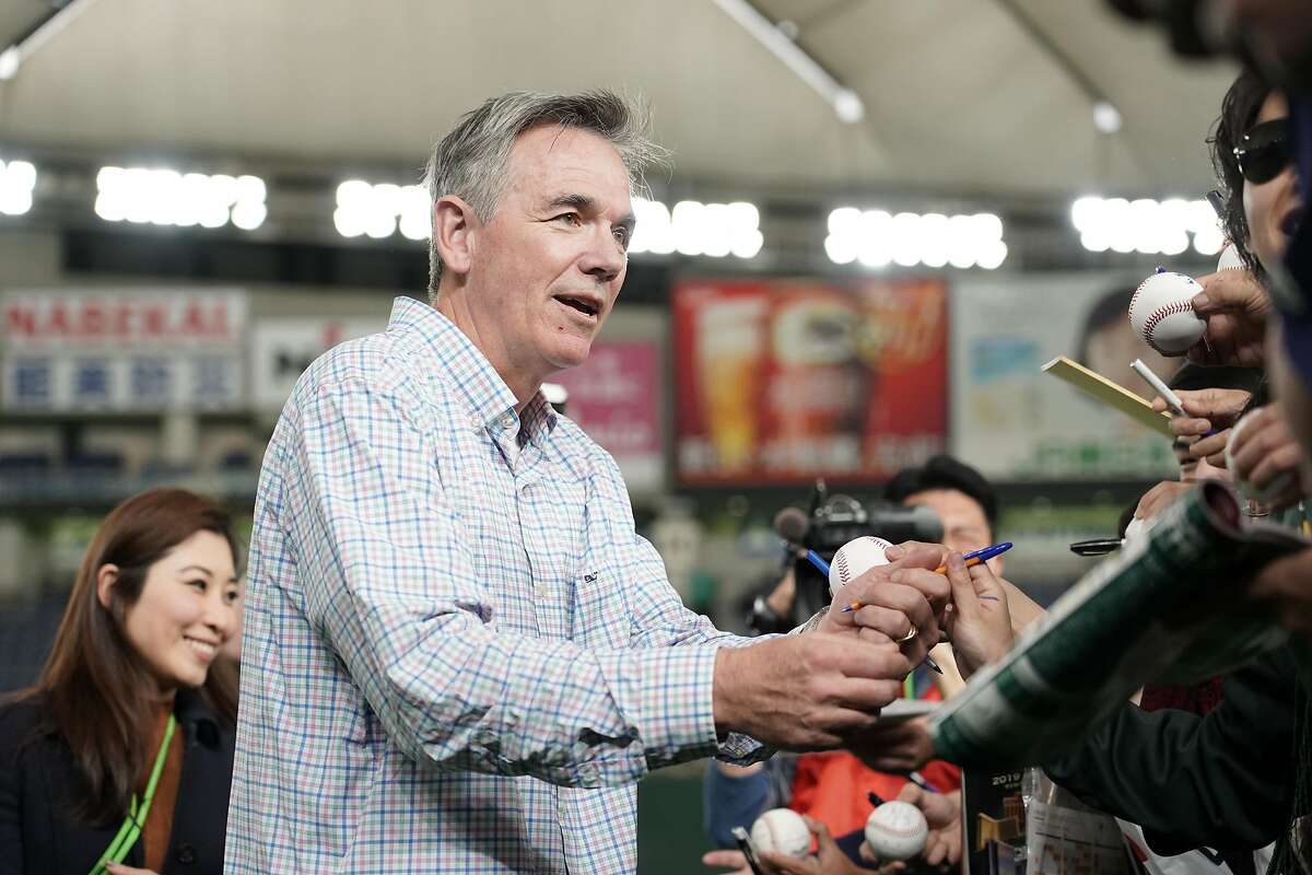 TOKYO, JAPAN - MARCH 18: Oakland Athletics Executive Vice President Billy Beane signs autographs for fans prior to the preseason friendly game between Hokkaido Nippon-Ham Fighters and Oakland Athletics at Tokyo Dome on March 18, 2019 in Tokyo, Japan. (Photo by Masterpress/Getty Images)