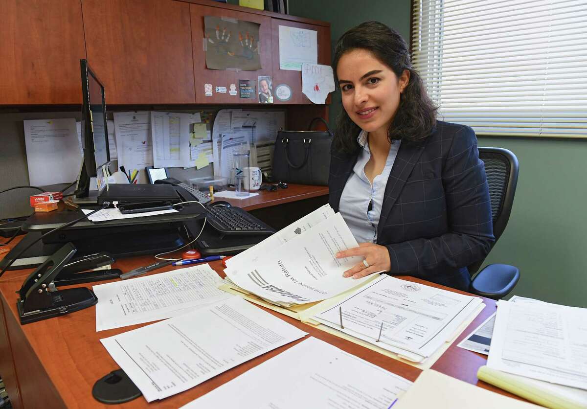 Azin Ahmadi, an immigration attorney, is seen in her office at The Legal Project Office on Friday, Sept. 27, 2019 in Albany, N.Y. Ahmadi runs a program that focuses on providing resources to muslim immigrants who are domestic violence survivors. (Lori Van Buren/Times Union)