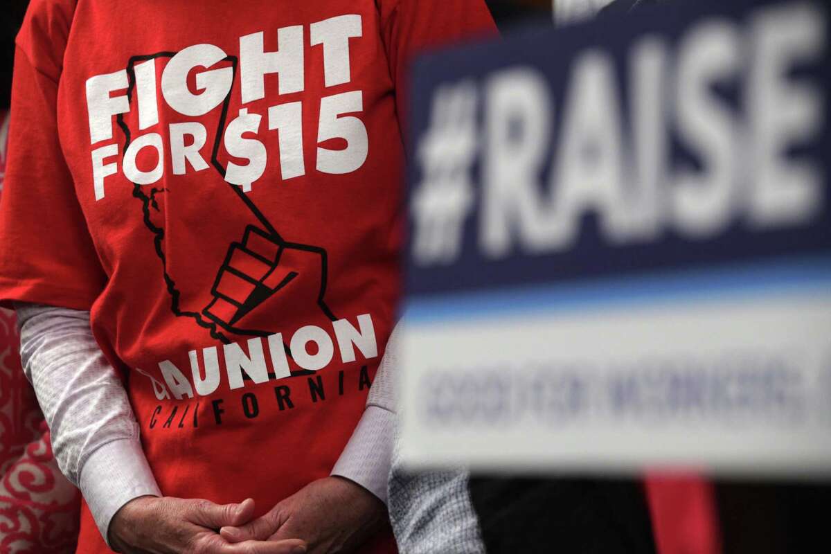 WASHINGTON, DC - JULY 18: An activist wears a "Fight For $15" T-shirt during a news conference prior to a vote on the Raise the Wage Act July 18, 2019 at the U.S. Capitol in Washington, DC. The legislation would raise the federal minimum wage from $7.25 to $15 by 2025. (Photo by Alex Wong/Getty Images)