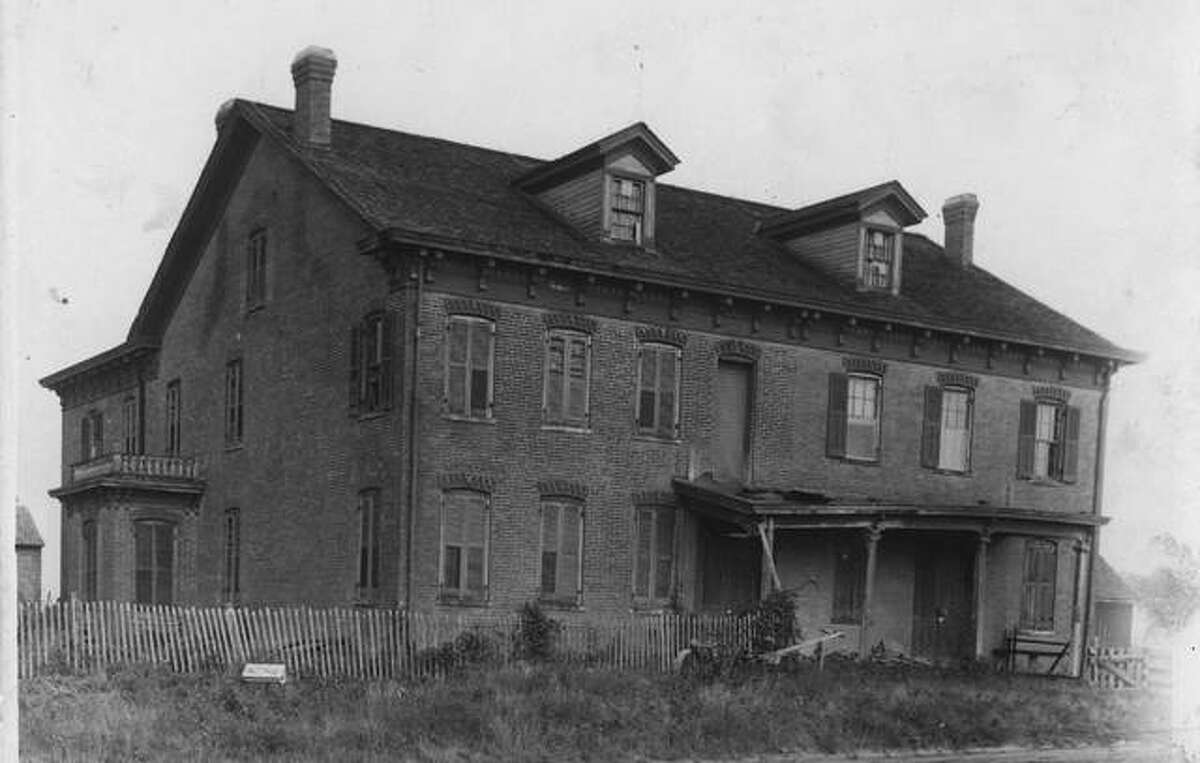 FILE - This a photo of Three Mile House in Edwardsville from 1912. The house was built in the 1850s. 