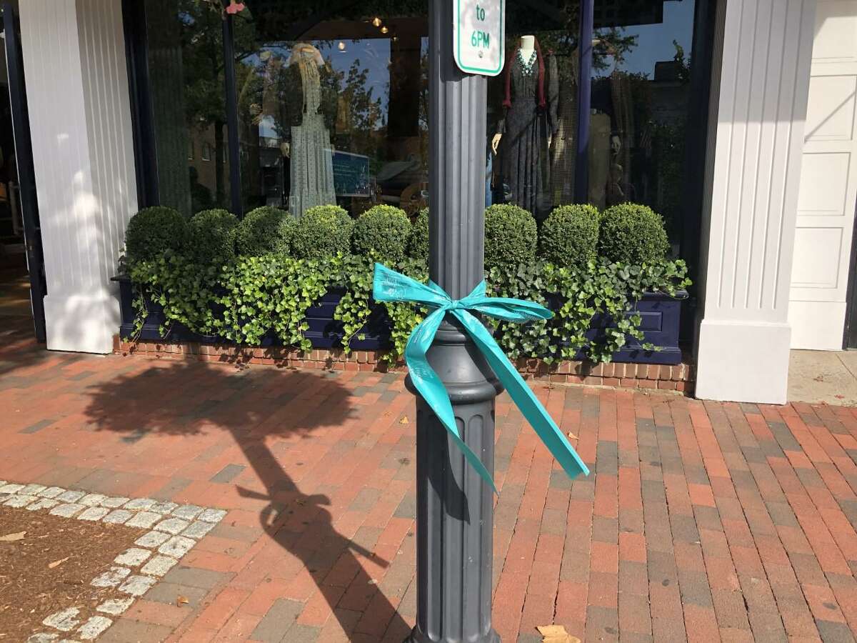 Pictured is one of the many teal ribbons that are on light posts on Main Street, and Elm Street in New Canaan, Connecticut for Ovarian Cancer Awareness Month. Contributed photo