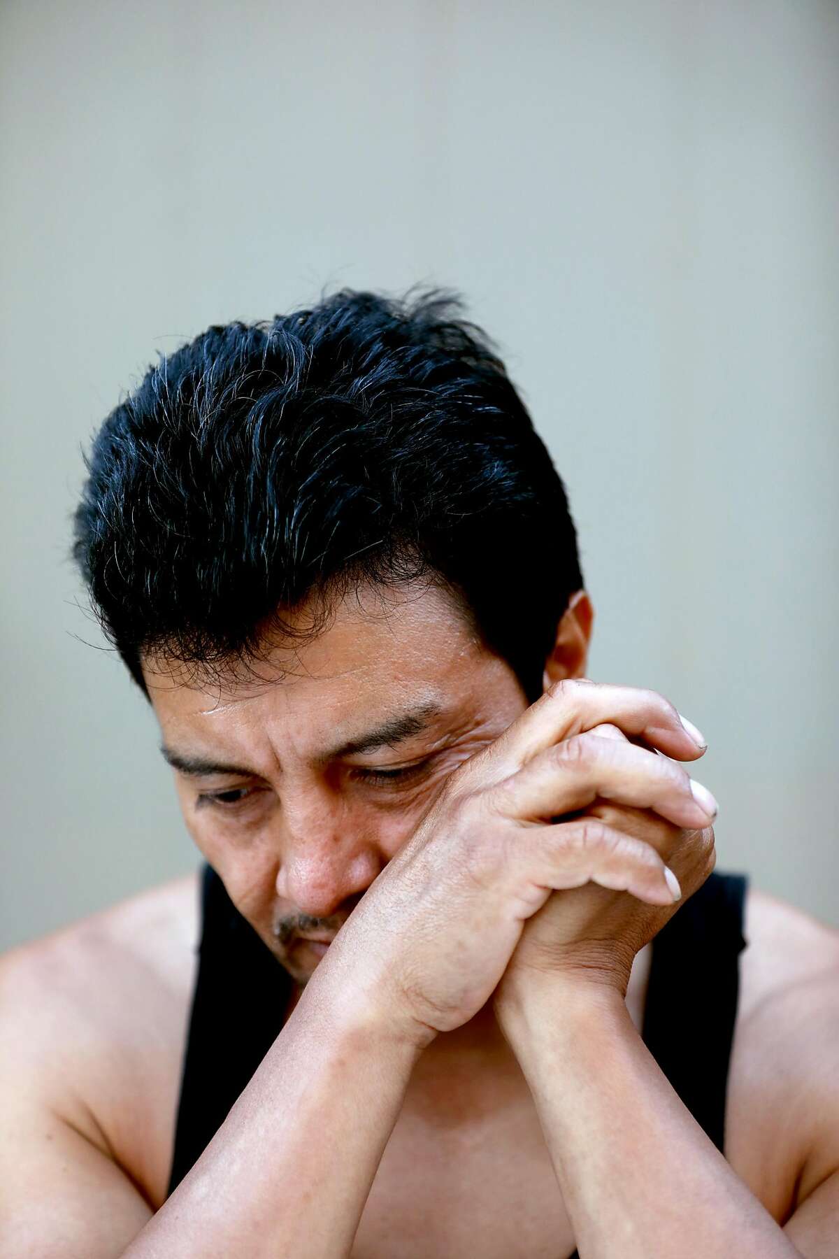 Raul Lopez, 47, remembers his late brother who passed away in 2017 as he sits at his home in Richmond, Calif., on Tuesday, September 24, 2019. Lopez, originally from Guatemala, is an undocumented immigrant who was detained by ICE for 2 years before being released in February.