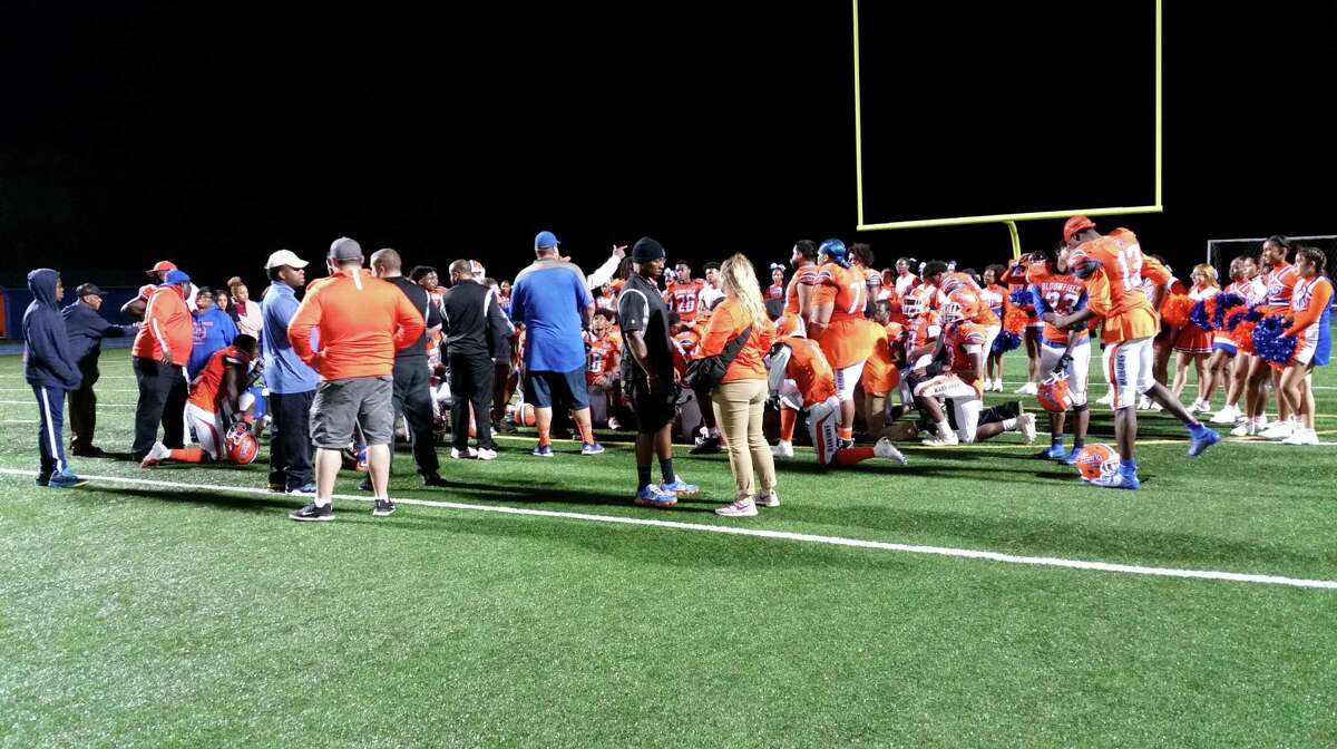 Bloomfield huddles after a 48-0 home win over Hillhouse at Phil Rubin Stadium on Sept. 27, 2019.