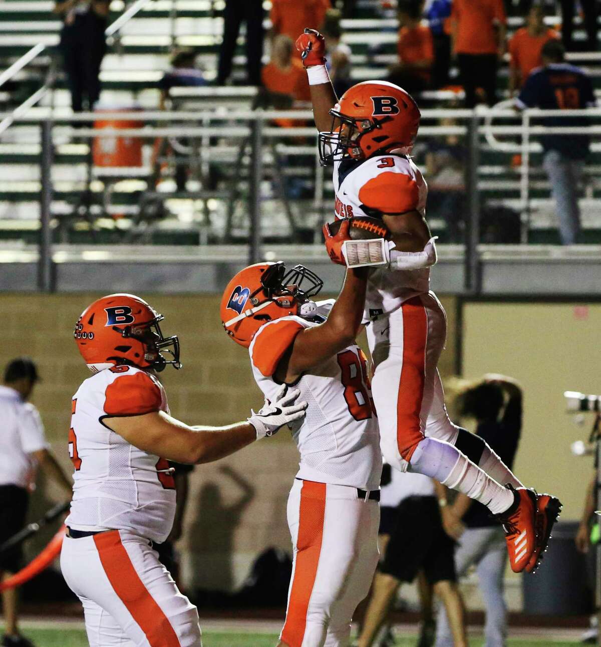 Brandeis' running back Corion Holmes (03) gets lifted up by teammate Kris Bowen (89) after Holmes scores a touchdown against Brennan during their game at Farris Stadium on Friday, Sept. 27, 2019. (Kin Man Hui/San Antonio Express-News)