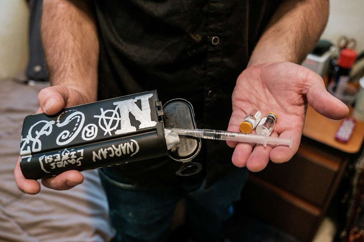 Nic Atamaniuk, a former heroin addict, displays his narcan container while in his room at the Mina Lee SRO. Alarmed at the spike in fentanyl overdose deaths, San Francisco's Public Health Dept. is creating an OD prevention program for the city's vast network of gritty SRO (single-room occupancy) buildings that will train residents and managers on how to best stop people from dying from the drug. The city is on pace to nearly double the number of fentanyl overdose deaths, and with 30 percent of such ODs coming in SROs, the health department decided to lean in hard with state and federal funding, on Sept. 6 in San Francisco, Calif. on Friday, September 27, 2019.