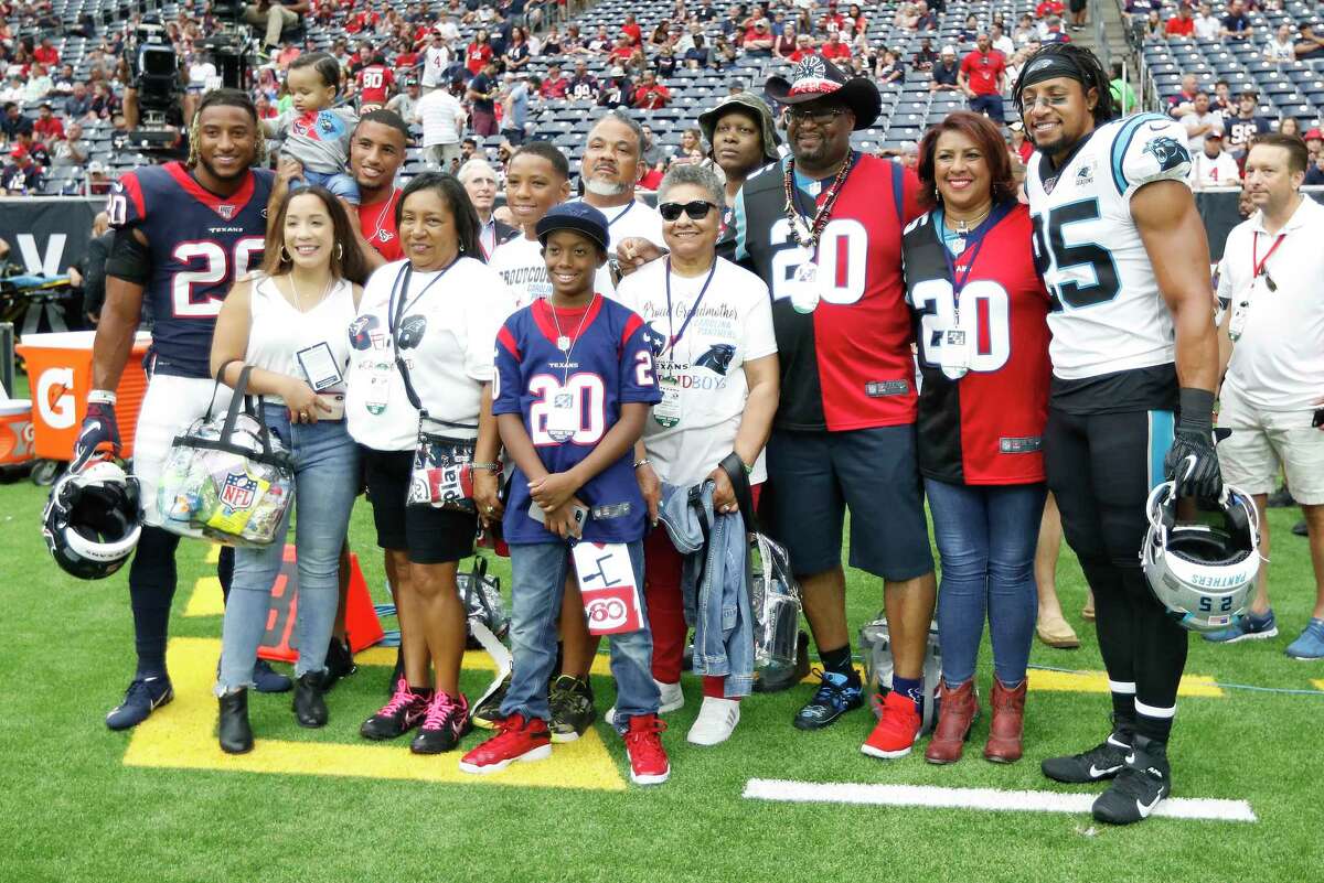 The Reid family wearing dueling jerseys for their sons Houston Texans strong safety Justin Reid (20) and Carolina Panthers strong safety Eric Reid (25) before the start of an NFL football game at NRG Stadium on Sunday, Sept. 29, 2019, in Houston.
