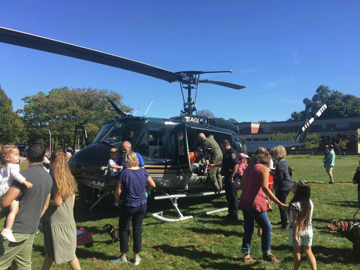 Visitors take a close look at Eagle One during the Ridgefield Police Department's Safety Day Sunday, Sept. 29.
