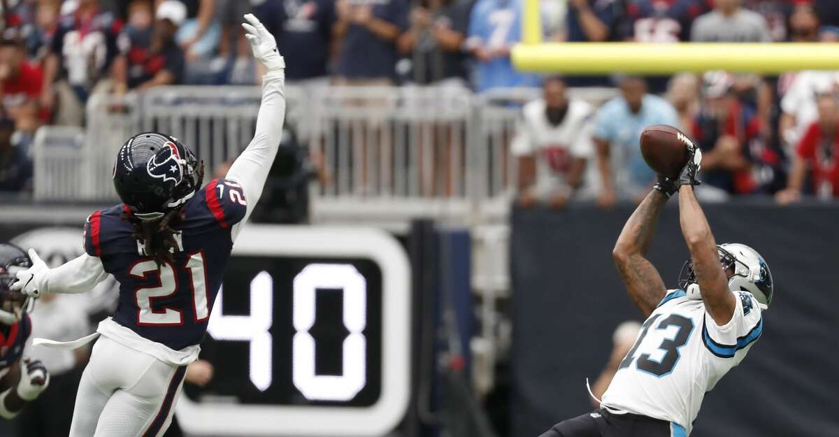 Carolina Panthers wide receiver Jarius Wright (13) beats Houston Texans cornerback Bradley Roby (21) for a first down reception during an NFL football game at NRG Stadium on Sunday, Sept. 29, 2019, in Houston.