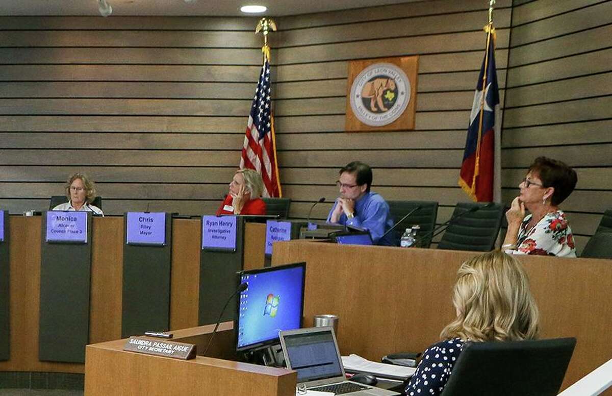 A group of residents are gathering signatures on petitions to recall City Councilors Monica Alcocer (far left) and Donna Charles, shown during July 18 testimony at a forfeiture hearing for Councilor Benny Martinez. Alcocer and Charles voted to declare his seat forfeited a vacant under the City Charter.