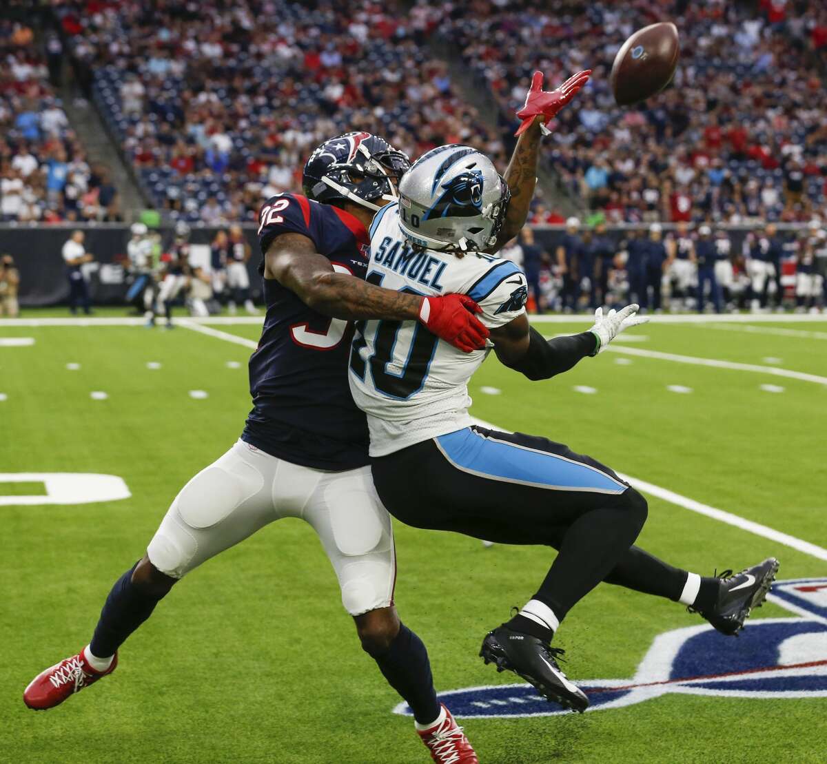 Houston Texans cornerback Lonnie Johnson (32) gets tangled up with Carolina Panthers wide receiver Curtis Samuel (10) and is called for pass interference during an NFL football game at NRG Stadium on Sunday, Sept. 29, 2019, in Houston.